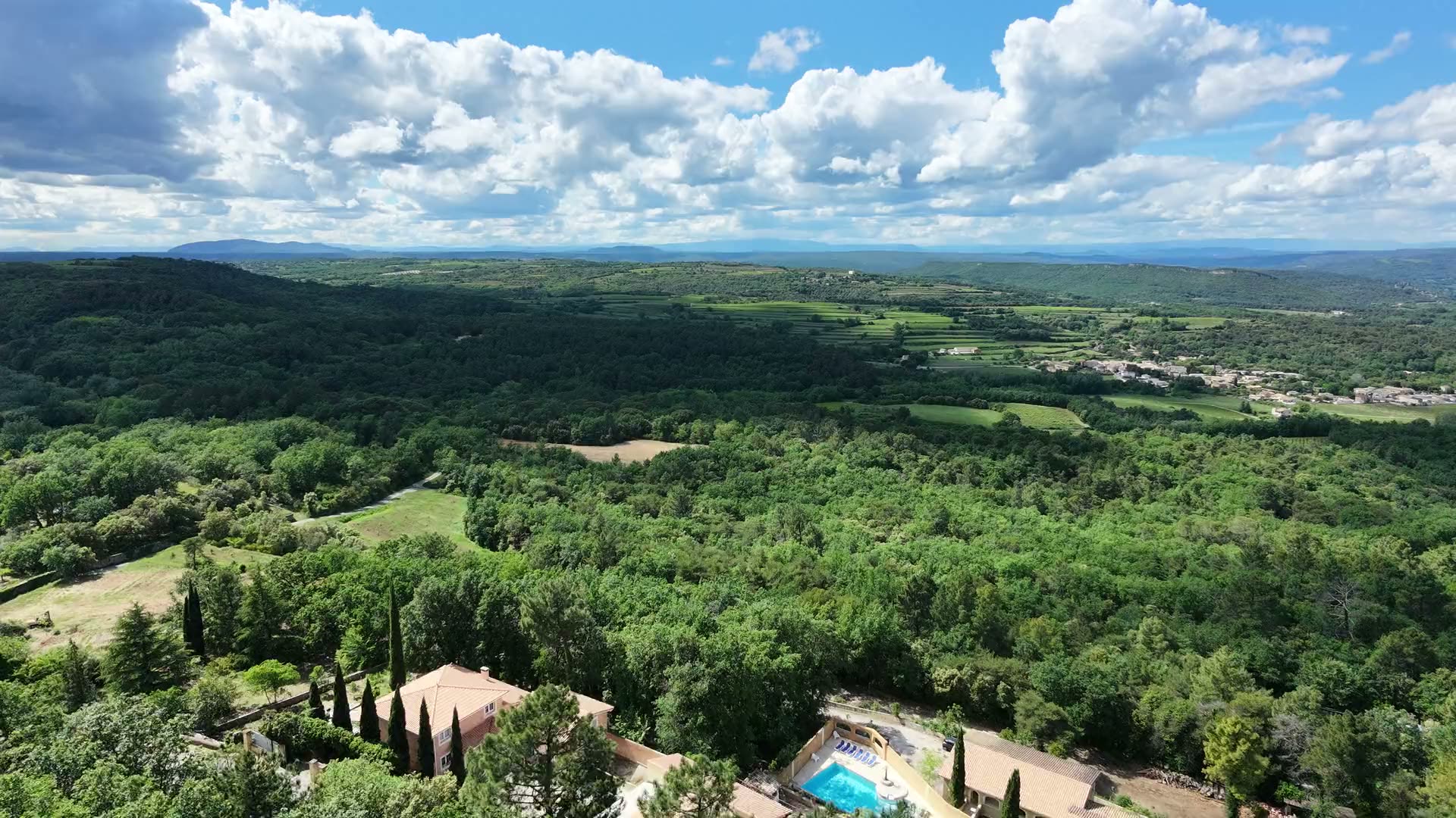 Aerial view of La Pousterle de Sabran, its pool and the Gard valley beyond