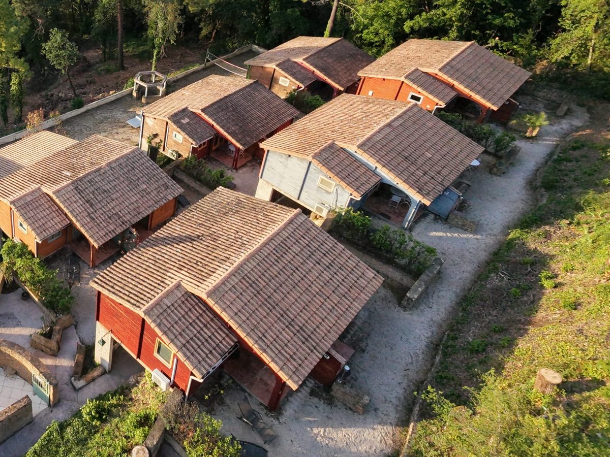 The chalets of La Pousterle de Sabran at sunset, where the wedding guests stay