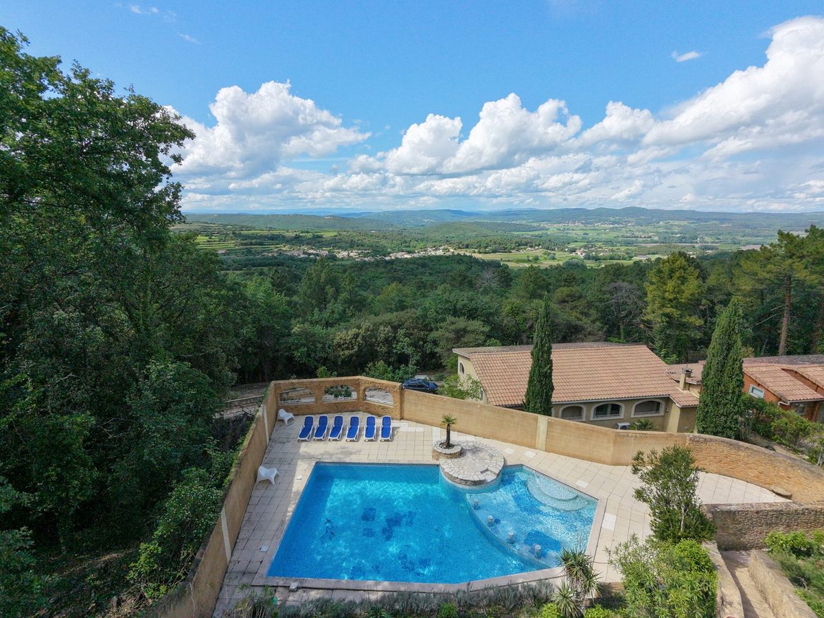 The heated pool at La Pousterle de Sabran facing the valley, seen from above