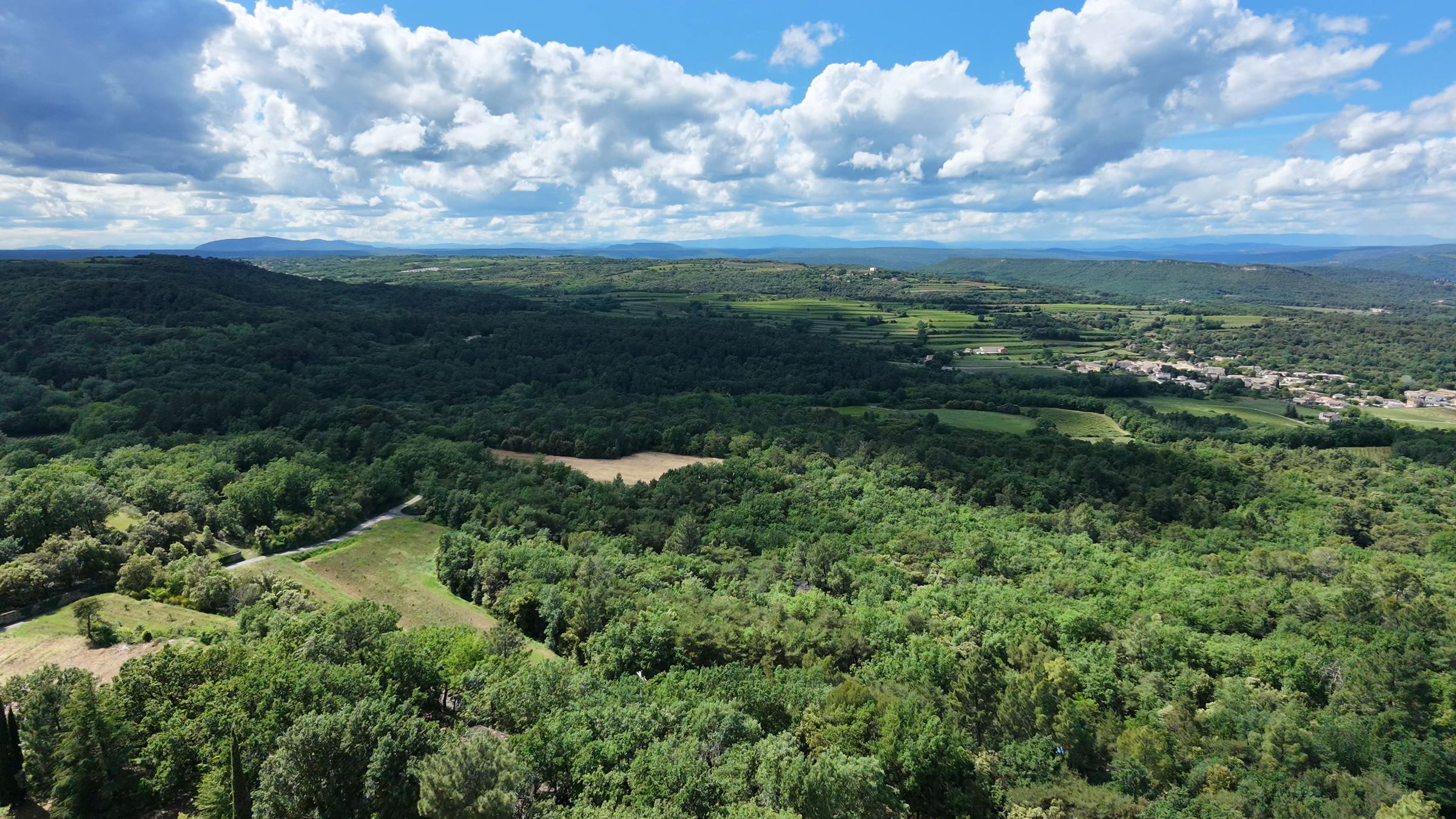 Aerial view of the wooded valley around Sabran, where the guided hikes of the wellbeing week take place