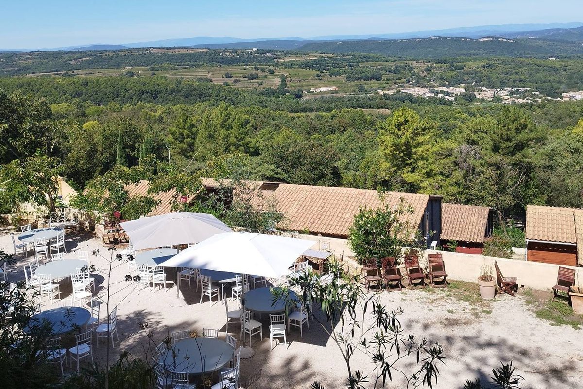 Reception terrace laid facing the valley at La Pousterle de Sabran in the Gard